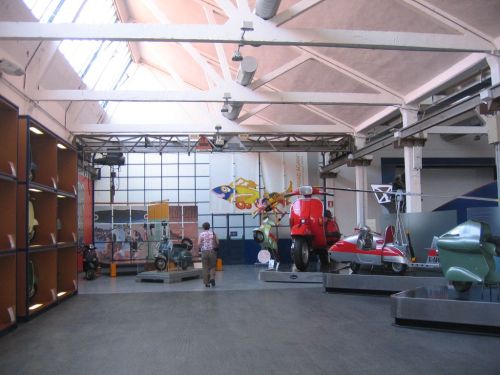 Vespa museum 008 Pauline admiring the Dali Vespa, note giant PX200 on right